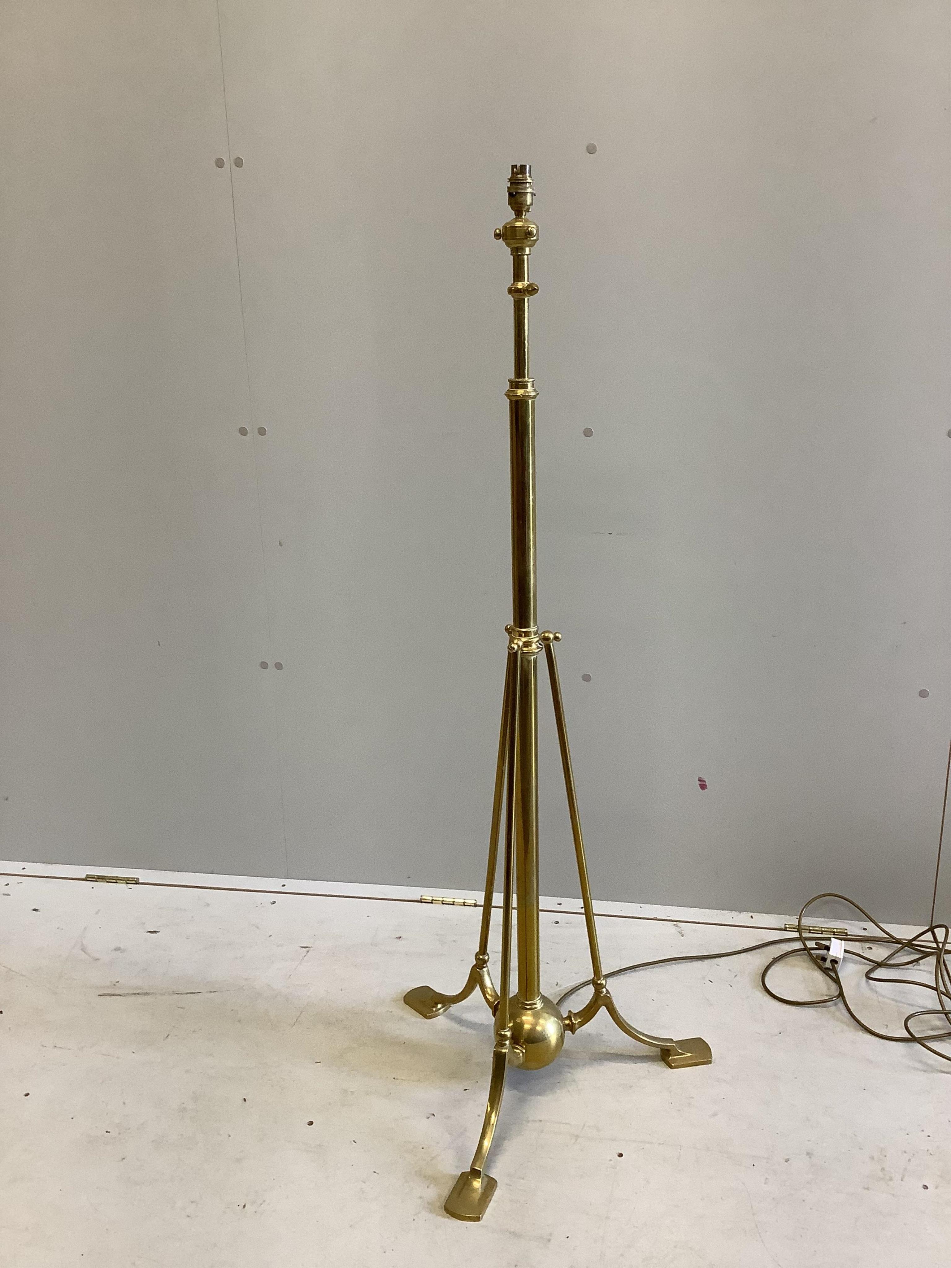 An Edwardian brass telescopic lamp standard, in the manner of Benson, height 140cm. Condition - good